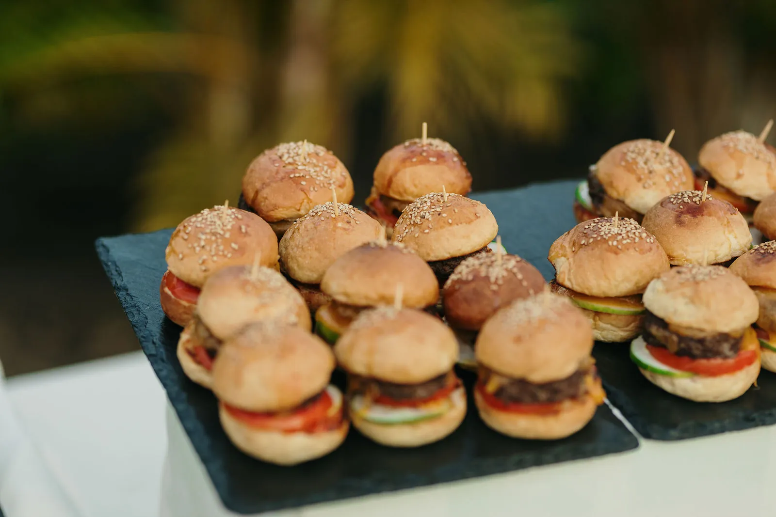 Mini burger sliders served on a slate board